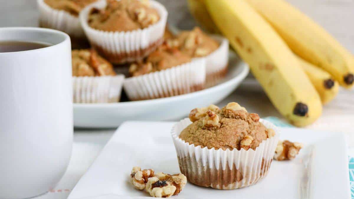Banana oat muffins on a square white plate.